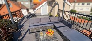 a bowl of fruit on a table on a balcony at Mirador de Tambo - Campelo in Poio