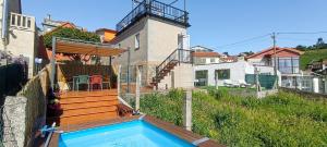 a house with a swimming pool in the backyard at Mirador de Tambo - Campelo in Poio +33 photos