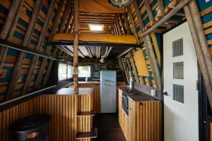 an inside view of a kitchen in a bus at Glampervan Rietje in Den Bosch