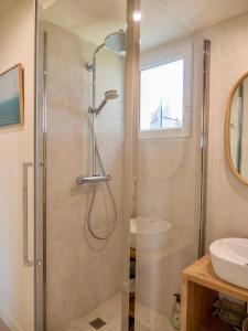 a bathroom with a shower and a sink at Palmito in Bidart