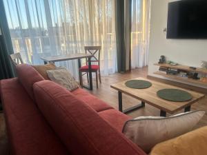 Et sittehjørne på Apartament dębowy + 10 bilder