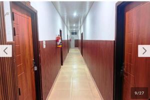 a hallway with two doors and a hallway with a corridorngthngthngthngthngth at Hotel moon in Pāonta Sāhib +2 photos