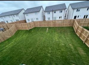 a yard in front of a row of houses at Gilded Nest-Room with Detached Bath- Ideal for ONE- WIFI, Car Parking-Shared House in Newarthill