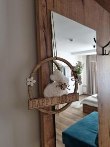 a mirror with a happy easter sign in a room at SKYLINE apartments Kopaonik in Kopaonik