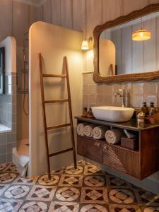 a bathroom with a sink and a mirror at Casa Con Destino in Jalón +59 photos