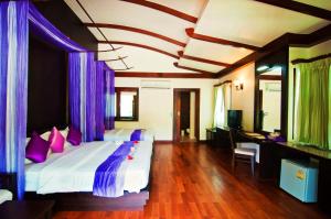 Postel nebo postele na pokoji v ubytování Aonang Phu Petra Resort, Krabi - SHA Plus