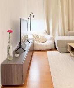 a living room with a table with a mirror and a couch at Apartment in Leipzig in Leipzig