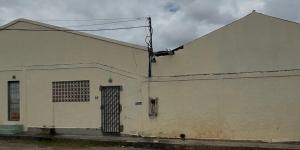 a white building with a door on the side of it at Guest House da Amazônia in Manaus