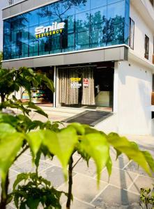 a building with a sign on the front of it at Smile Residency in Sultan Bathery +11 photos