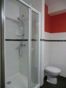 a bathroom with a shower and a toilet at Ace Hôtel Paris Marne La Vallée in Bailly-Romainvilliers