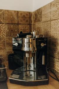 a black and silver coffee maker sitting on a counter at Ta Chalupa in Prostřední Bečva