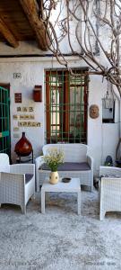 a room with couches and a table and windows at La Casa di Marla in Sirmione