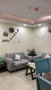 a living room with a couch and a table at The Horizon House in Zirakpur