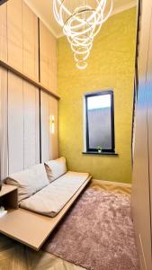 a bed in a room with a window at Лофт отель 11eleven in Shymkent