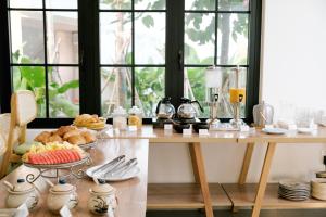 a table with a tray of food on it at Sadec Garden Boutique Hotel in Ấp Tân Thành (2)