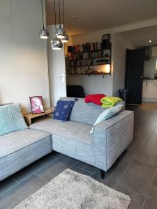 a living room with two couches and a couch at Zonnehoek in Bruinisse