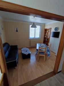 a living room with a couch and a table at Chez Famille RENTZ in Riquewihr