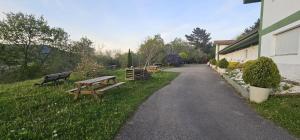 a picnic table and benches on the side of a road at BIZIA Vida Apartamento 5 in Sopuerta +8 photos