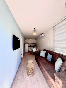 a living room with a couch and a table at The blue lagoon in Ohrid