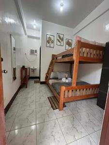 a bedroom with two bunk beds in a room at Dodong homestay 2 in General Luna