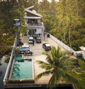 an aerial view of a house with a swimming pool at The Cove Beach Resort in Cochin