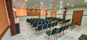 a conference room with chairs and a table in it at Royal Palace in Chāvasseri +22 photos