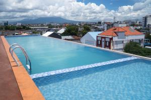 a large swimming pool on the roof of a building at Liberta Malioboro North in Yogyakarta