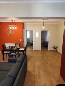 a living room with a couch and a table at The Hammam Guest House in Nydri