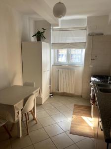 a kitchen with a table and a table and a table and a kitchen sidx sidx at Casa Paoli in Salerno