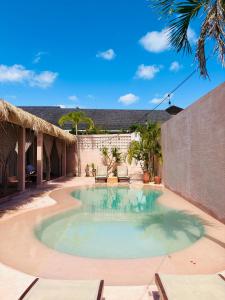 a swimming pool in the middle of a courtyard at Le Bohémien Suites Cabana in Dalung
