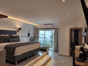 a bedroom with a bed and a balcony at Villa Nina Adult only in Skiathos +128 photos