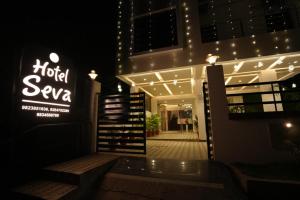 a building with a sign that reads hotel savaya at Hotel Seva in Nagpur +7 photos