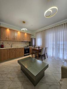 a large kitchen with a table and a dining room at Flogita Dream in Flogita