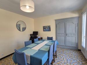 a meeting room with two tables and a mirror at Lake Villa Castéra-Verduzan in Castéra-Verduzan +13 photos