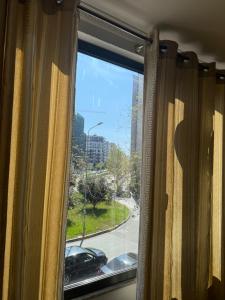a window with a view of a street at Ikea hotel in Kashari