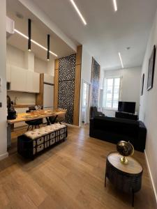 a living room with a couch and a table at APART_SANVICENTE 6 in Vigo