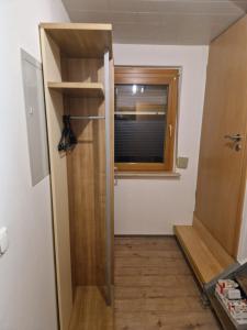 a hallway with a door and a window in a room at Herzstück in Grafenrheinfeld +1 photo