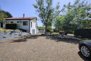 a driveway in front of a white house at Apartamenty Tarcal in Tarcal +17 photos