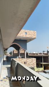 a view of a building with the word monday written on it at Shri Janki Raman kunj 5 minut from ram mandir in Ayodhya
