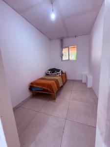 a bedroom with a bed in a white room at ברזיליאנו - Braziliano in Eilat