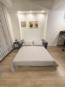 a bedroom with a large bed in a room at Aura Urbana Apartment in San Juan +29 photos