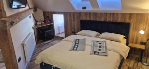 a bedroom with a bed with two towels on it at URBAN APARTHOTEL Medias in Mediaş