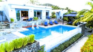 a swimming pool in front of a house at Lakeview Granada Hotel Boutique in Granada +145 photos