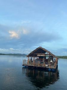 a bamboo boat on a large body of water at Krabi Floating Glamping in Ban Khlong Khae (2)