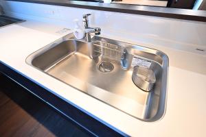 a stainless steel kitchen sink with a faucet at Manabi-WAN Takayama in Takayama +44 photos