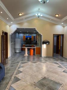 a large living room with a kitchen and a refrigerator at شالهيات ريست 2 in Hail +82 photos