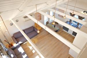 an overhead view of a living room with a couch at Bork Cozy Cottage in Hemmet