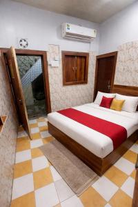a bedroom with a large bed in a room at Hotel Vrindavan Near Prem Mandir Distance 15 min in Mathura