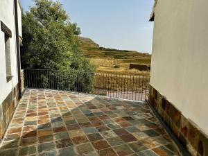 a balcony of a house with a fence at Valdelinares 365 in Valdelinares