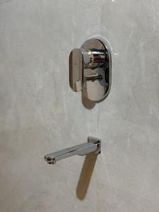 a metal object on a wall with a handle at Rudreshwar Mahadeo Kothi in Varanasi